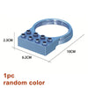 A blue marble run building block piece with a circular opening and multiple small holes.