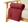 A deep red knitted shawl or blanket draped over a light-colored sofa next to a wooden frame.