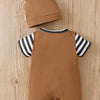 A brown baby romper and matching hat set with black and white stripes on the sleeves