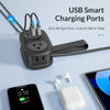 A black compact travel power strip with multiple USB charging ports and an AC outlet is shown next to a smartphone and tablet