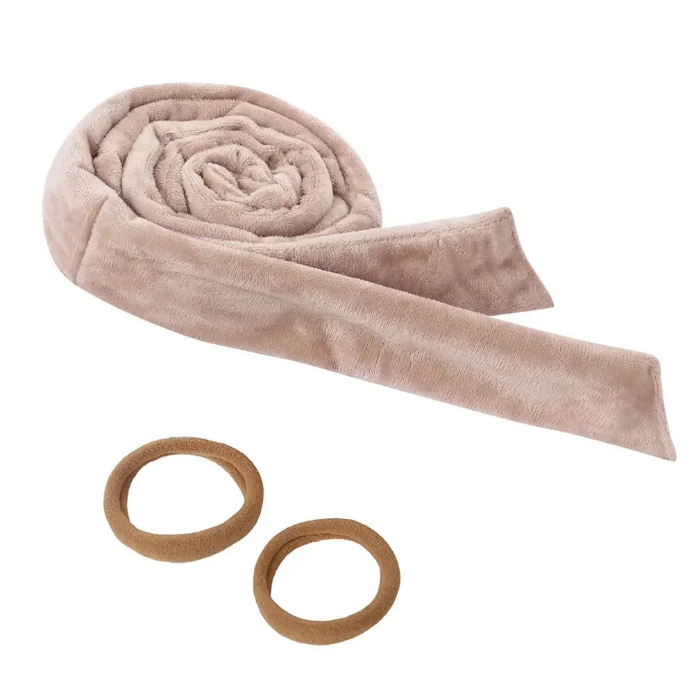 A light beige heatless curling rod headband rolled into a spiral shape.