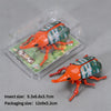 A wind-up insect toy resembling a ladybug or beetle is shown inside its clear plastic packaging.