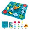A blue maze board game featuring interlocking green and yellow pieces, with an orange vehicle piece.