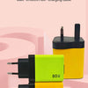 Two yellow and lime green 80W gallium nitride chargers with black retractable cables are displayed on a pink background.