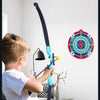 A young boy is shown using a black bow and arrow set to shoot an arrow at a target, illustrating the concept of a heroic drea