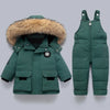 A dark green kids winter down coat featuring a natural fur collar, shown flat lay.