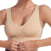 A beige breathable plus size sports bra being worn by a model.