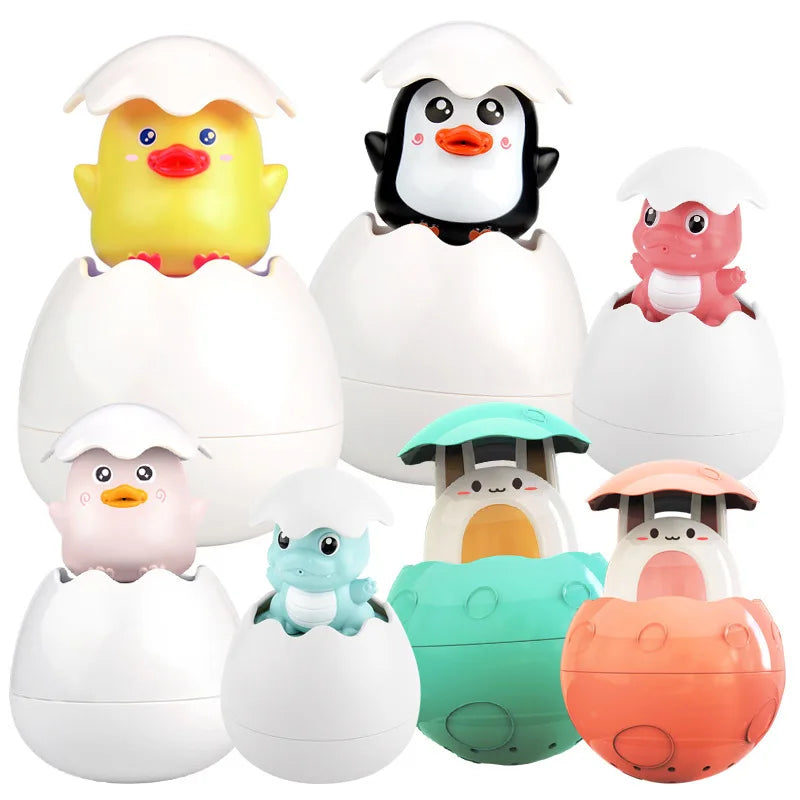 A collection of cute bath toys featuring a yellow duck and black penguin emerging from white egg-shaped containers.