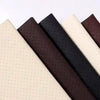 A close-up view of several self-adhesive PU leather repair patches in shades of brown, black, and cream.