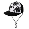 Black baseball cap with a white and black palm tree print.