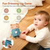 A baby is engaging in a fun dressing-up game with a wooden bear toy on a Montessori busy board.