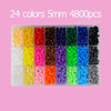 A collection of 24 colors of 5mm fuse beads in small plastic containers for crafting.