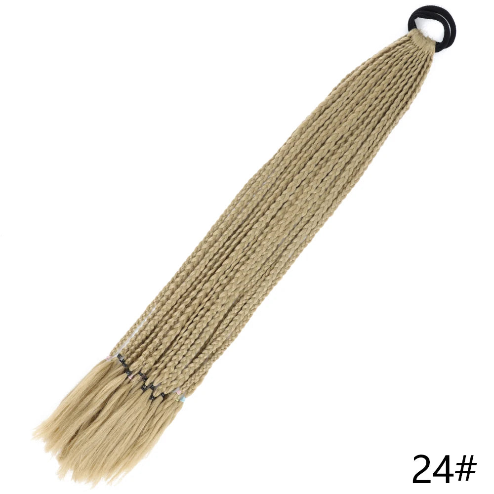 A light beige gradient pre-braided ponytail extension with an elastic band attached.
