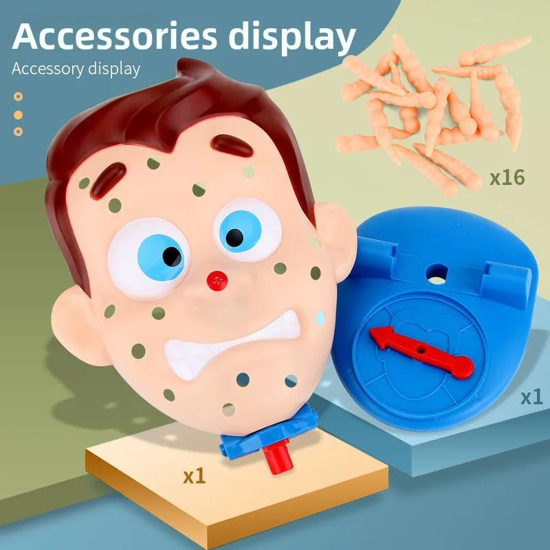An accessory display showing a pink and white acne popping squeeze toy, a blue cap, and several orange plastic sticks.