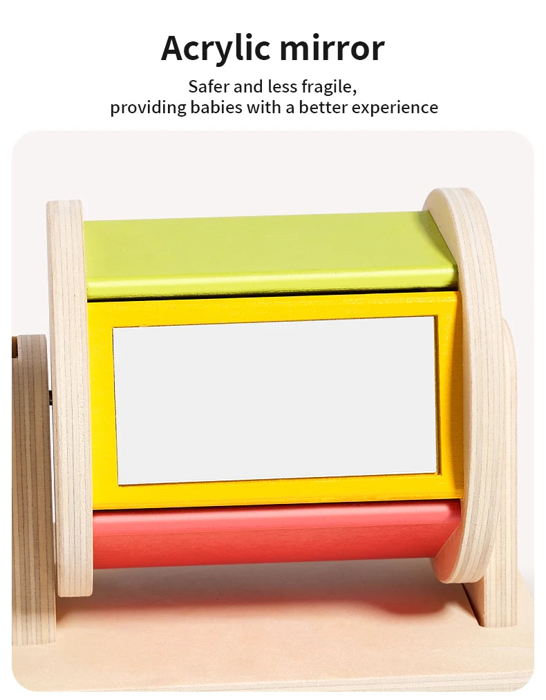 A wooden spinning drum with acrylic mirror in yellow and green colors for babies.