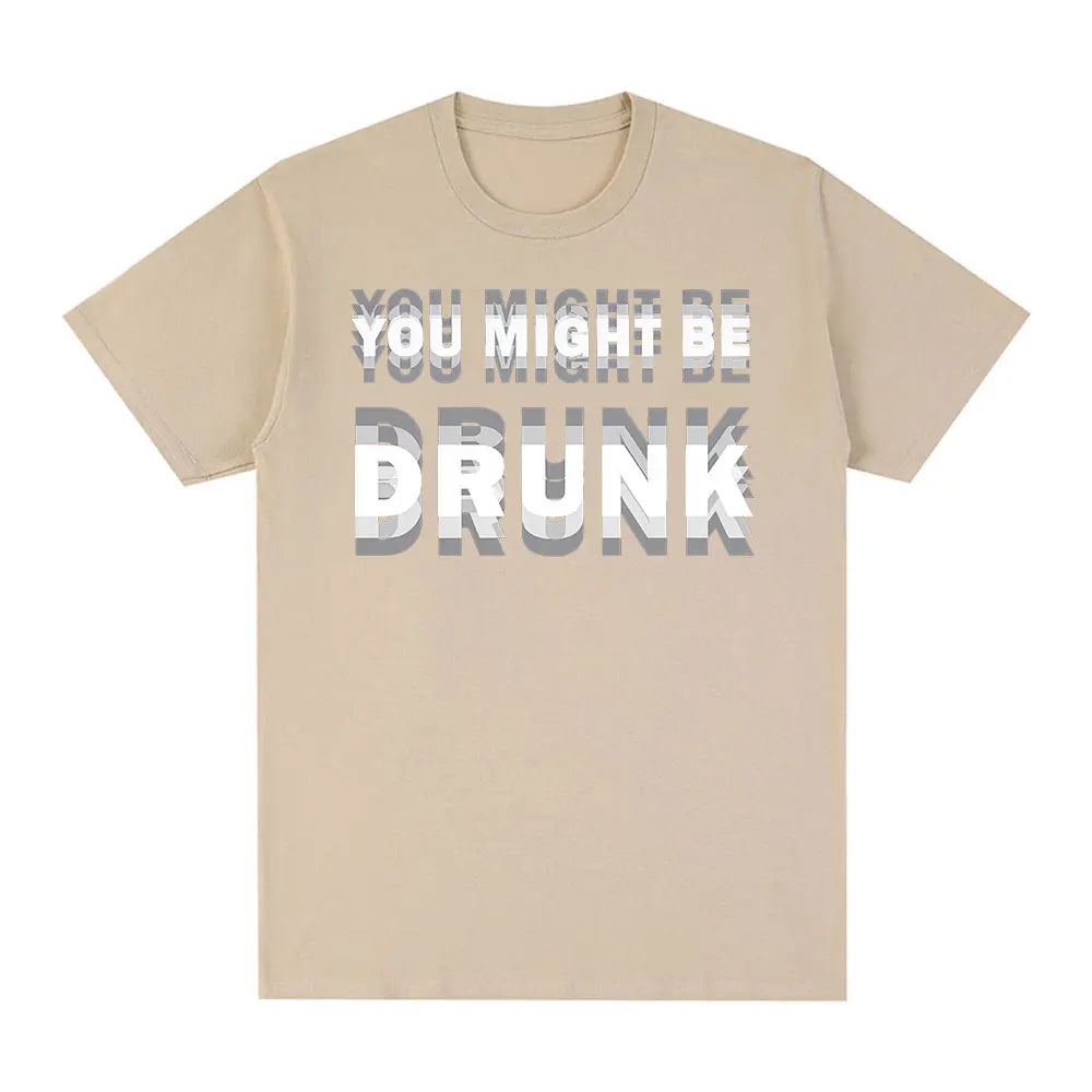 En lys beige t-shirt med teksten YOU MIGHT BE DRUNK i grå skrift.