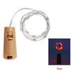 A roll of red LED fairy lights coiled around a cylindrical base for decorative lighting.