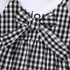 Black and white plaid girls' cotton knit dress with a bow detail
