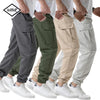 A group of men wearing various colored cargo joggers and white sneakers.