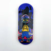 A black skateboard deck featuring a blue and purple graphic of a stylized alien character against a dark background.