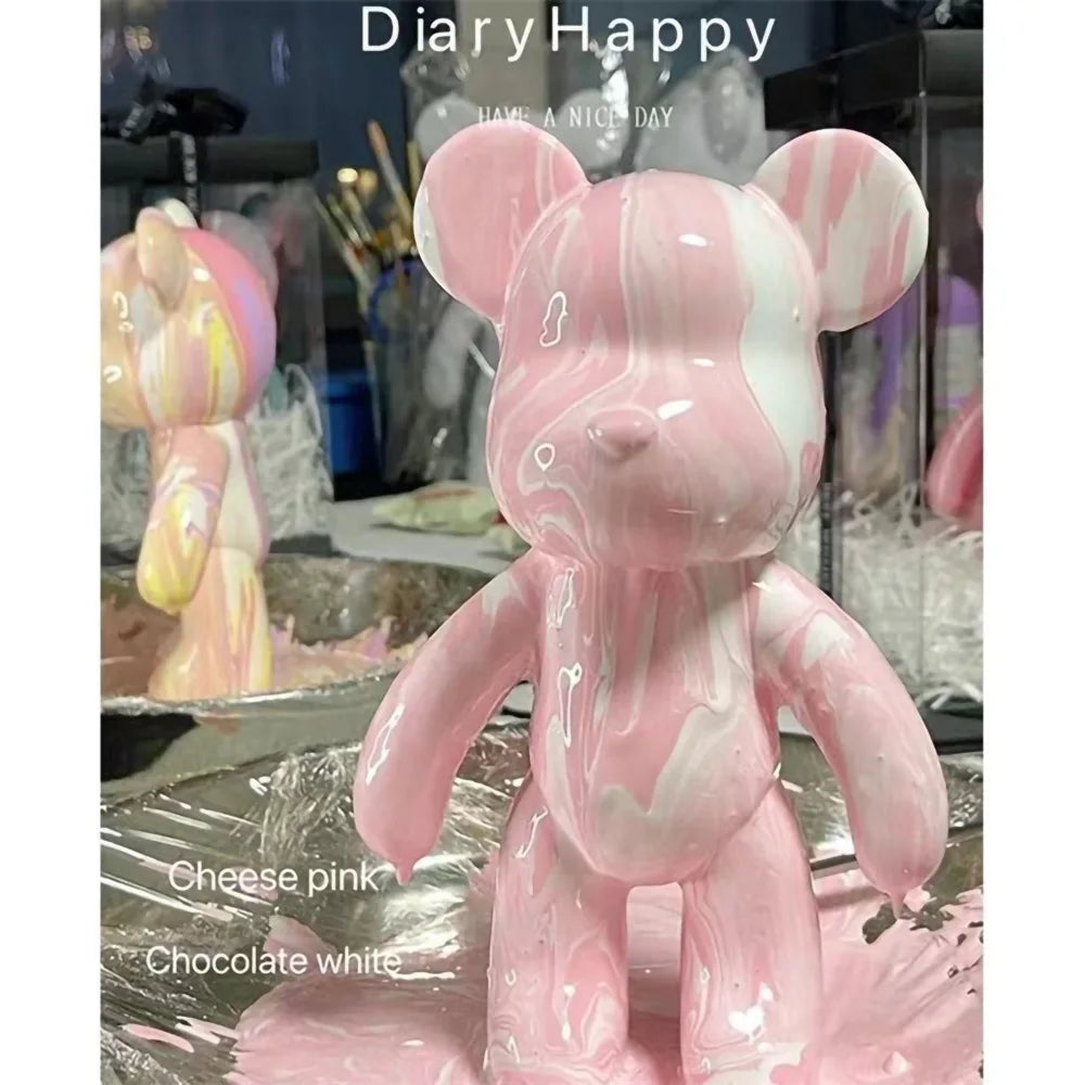 A pink bear figurine painted in a marbled cheese pink and chocolate white design.