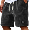 Shorts casuales de hombre con textura waffle y cordón, en negro con estampado a cuadros