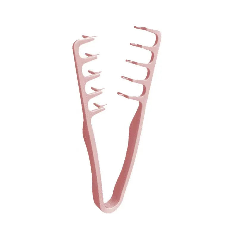A pink volumizing wide-tooth styling comb for men with a Korea style seam covering design.