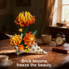A sculpture made of orange and yellow brick blooms, designed to freeze the beauty.