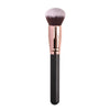 A professional makeup brush with a pink bristles and gold ferrule on a black handle.