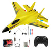 Yellow SU-27 foam airplane model with black nose, remote control transmitter, and battery components.