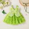 A light green tulle dress with a large butterfly appliqué and green suspenders, set against a neutral background.