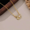 A gold chain necklace features an elegant heart pendant made with simulated pearls.