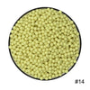 A circular arrangement of small, pale yellow water beads.