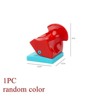 A red marble run building block with tracks and funnels shown on a light blue base.