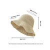 A beige crochet straw fisherman hat with a wide brim shown from the side.