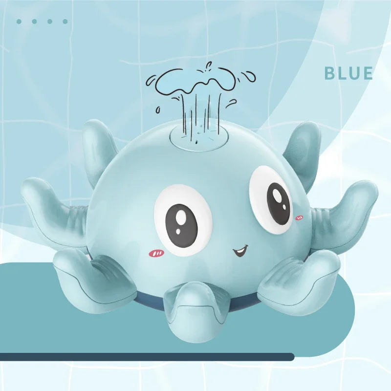 A cute, light blue musical whale bath toy with large eyes and fins is shown against a light blue background.