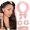 A woman wearing a pink heatless overnight curling headband with a satin finish.