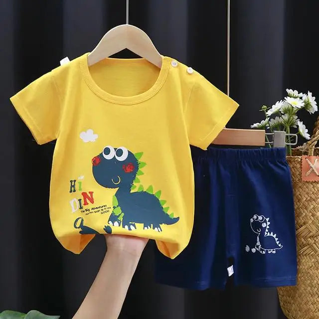 A yellow dinosaur print kids' short-sleeve t-shirt and shorts set displayed on a hanger.