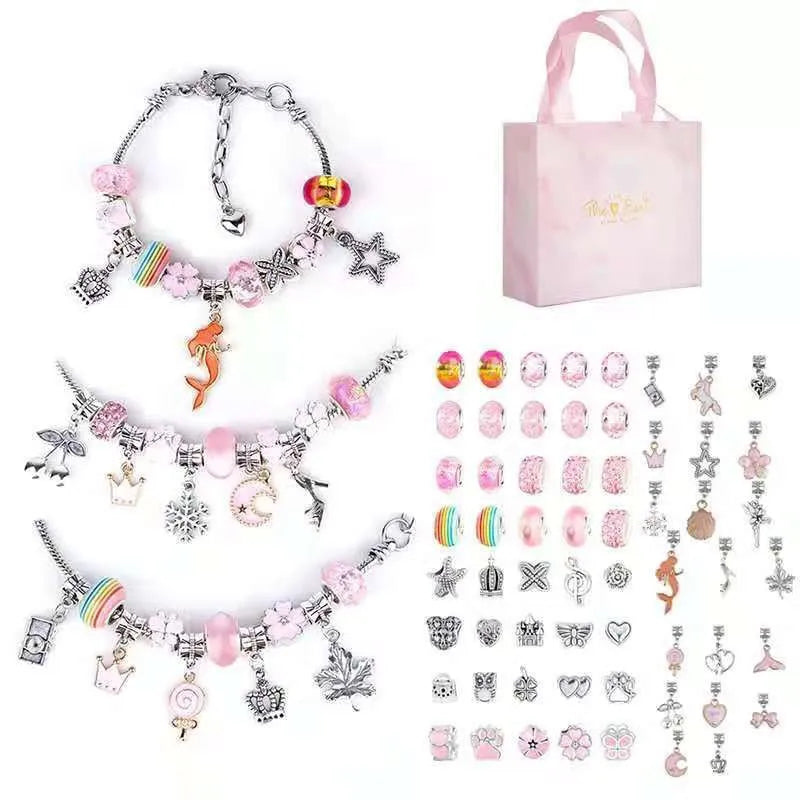 A pink gift box containing a charm bracelet making kit for girls with various charms and tools.