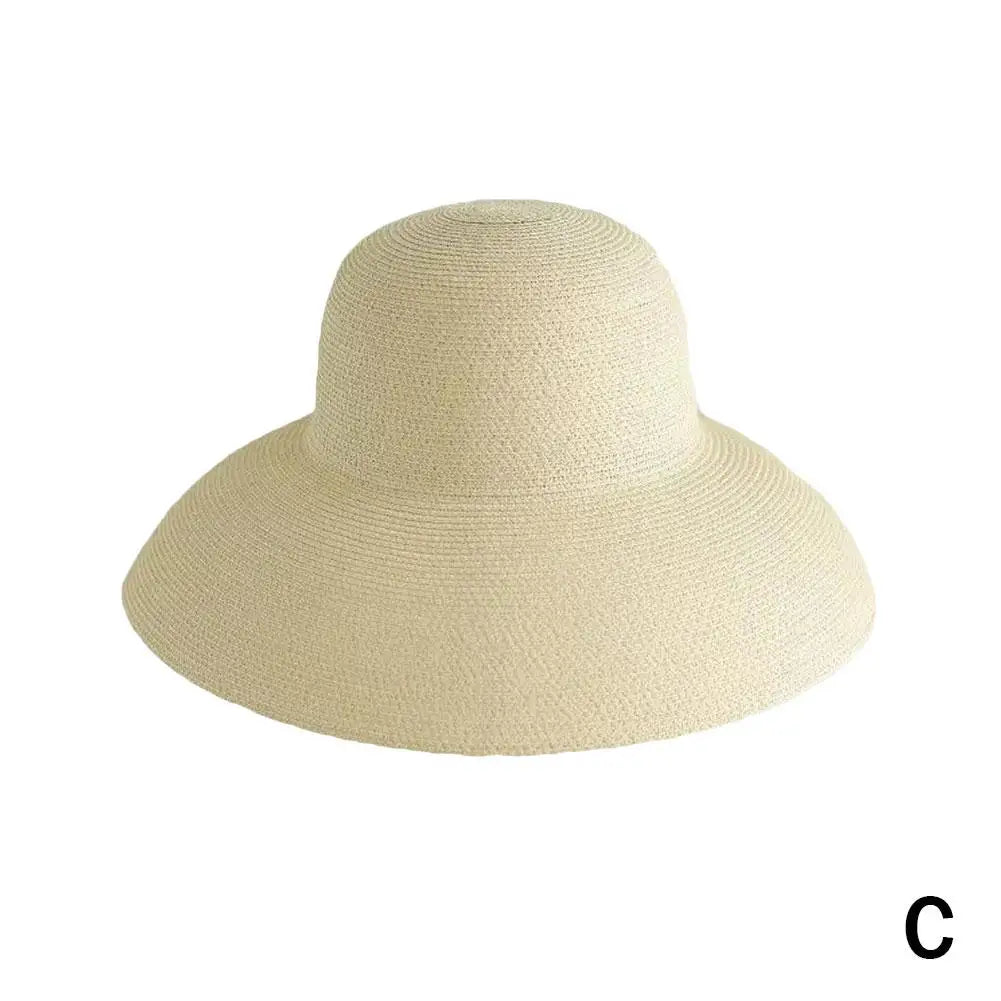 A beige wide brim straw sun hat for women.