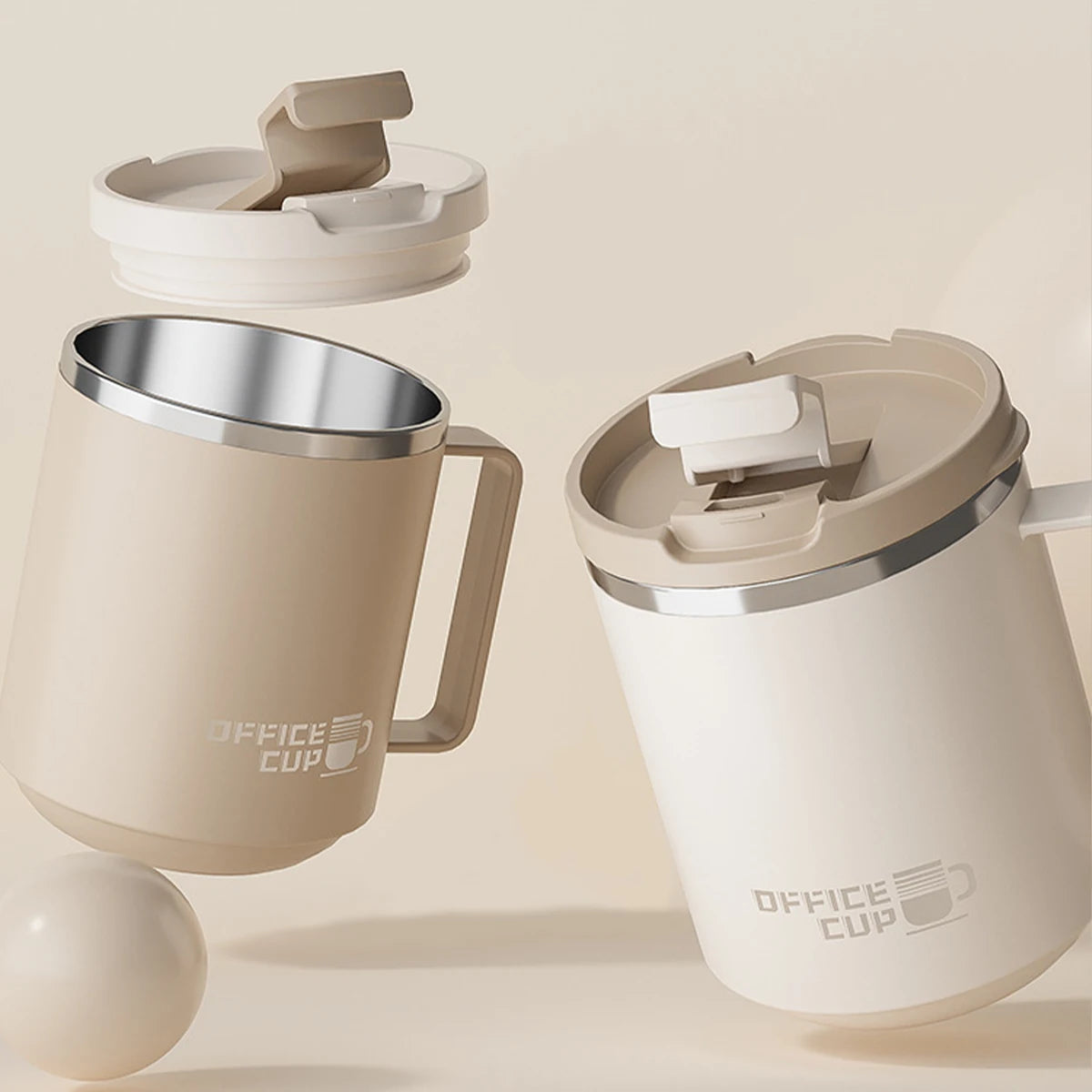 A beige double wall insulated stainless steel travel mug with a removable lid and handle shown in a studio setting.