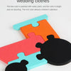 Colorful wooden jigsaw puzzle pieces shaped like animals in bright orange, pink, and blue colors