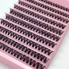 A pink plastic case containing ten pairs of ultra-dense false eyelashes with tightly curled synthetic fibers.