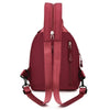 A maroon mini backpack with a zipper closure and adjustable strap is shown against a white background.