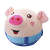 A pink plush pig toy with large ears and a blue collar.