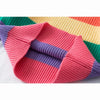 A close-up of a girls' rainbow striped knit sweater showing pink, purple, and yellow stripes.