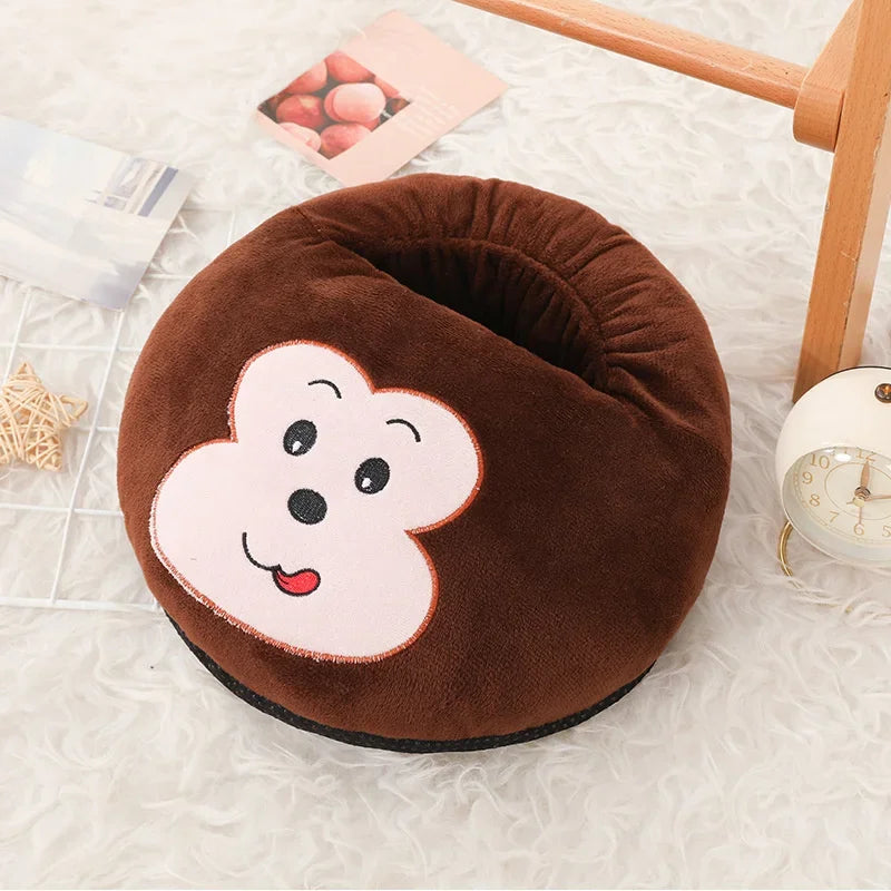 A brown fleece foot warmer shaped like a smiling white bear is shown on a white surface.