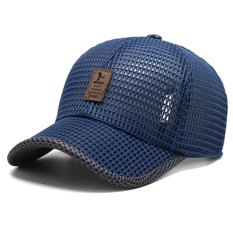 A dark blue mesh baseball cap with a brown leather patch and a gray brim.