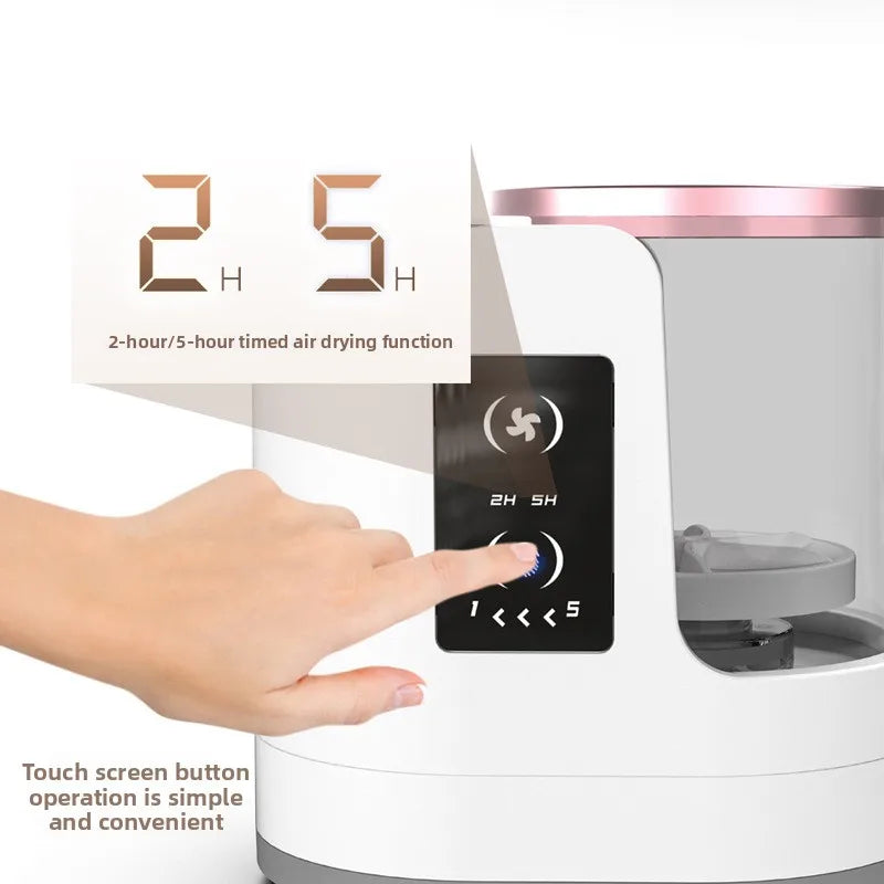 A hand touches the touch screen button on a white electric makeup brush cleaner with fast air dry function.