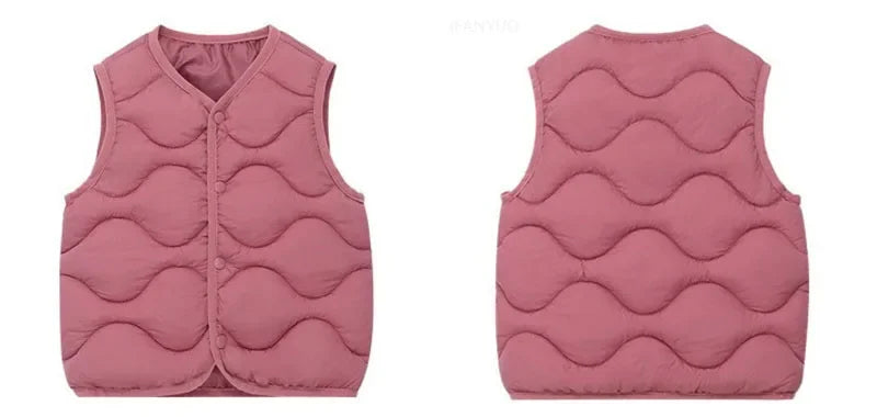 A pink quilted vest for a child shown from the front.